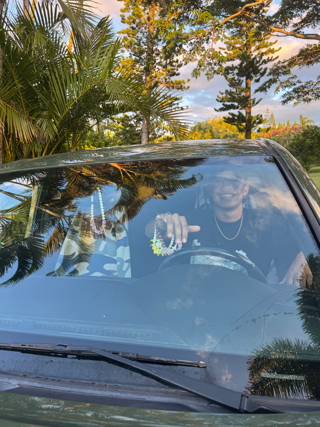 orange puakenikeni mirror lei for car