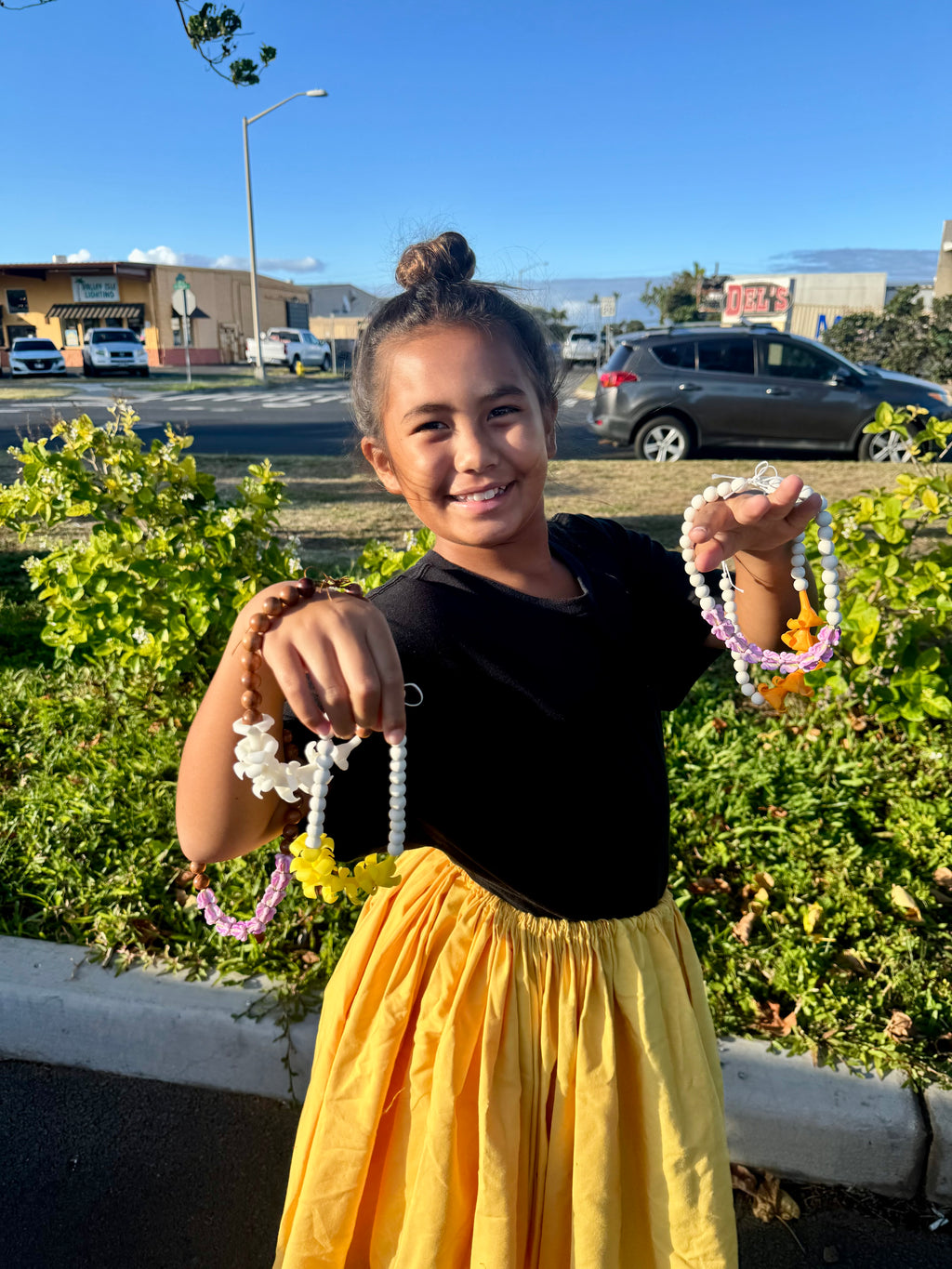 orange puakenikeni mirror lei for car